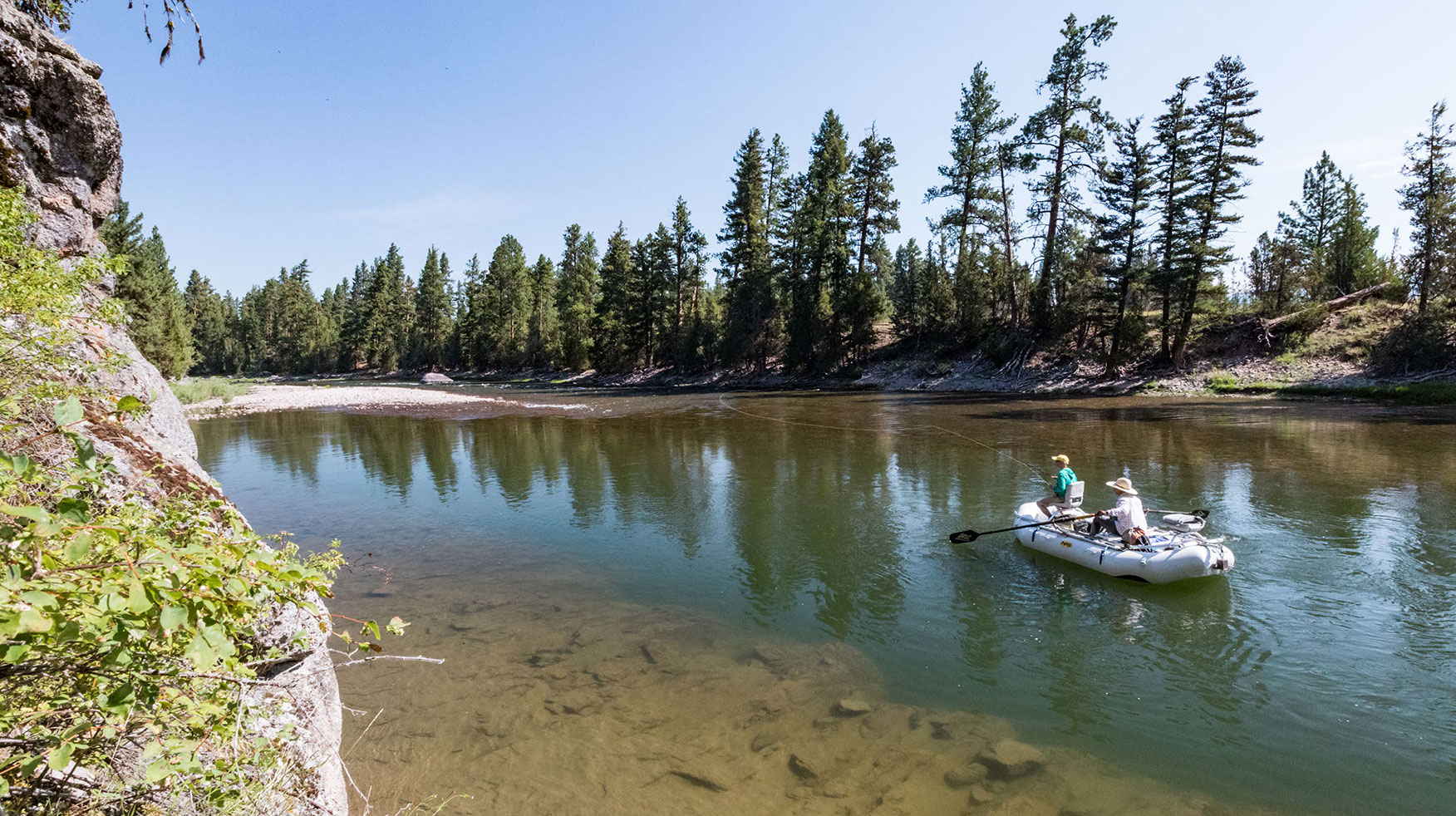 A drift boat float trip on a Montana river